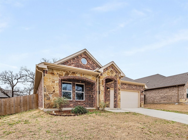 view of front facade featuring a garage and a front yard