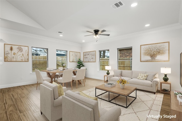 living room with light wood-style floors, recessed lighting, visible vents, and ornamental molding