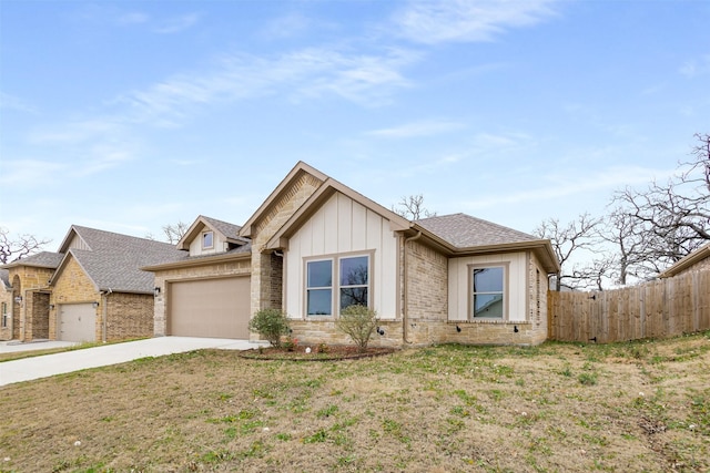 view of front of property featuring a garage, brick siding, fence, concrete driveway, and board and batten siding