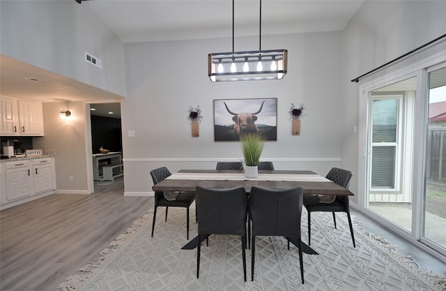 dining space featuring light hardwood / wood-style flooring