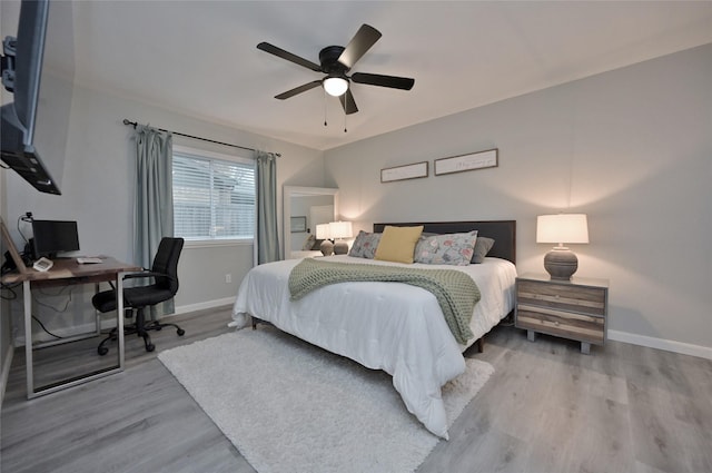 bedroom featuring wood-type flooring and ceiling fan