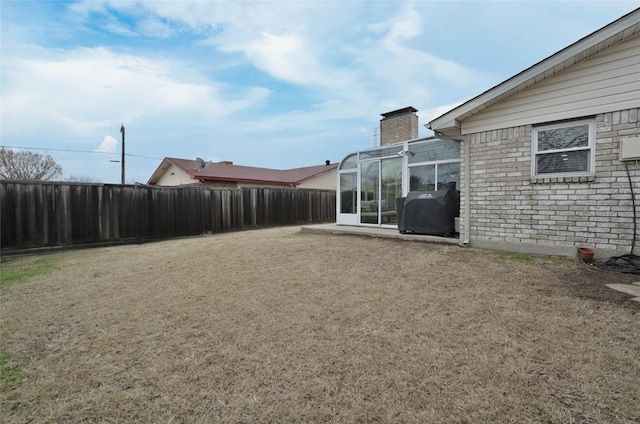 view of yard featuring a sunroom
