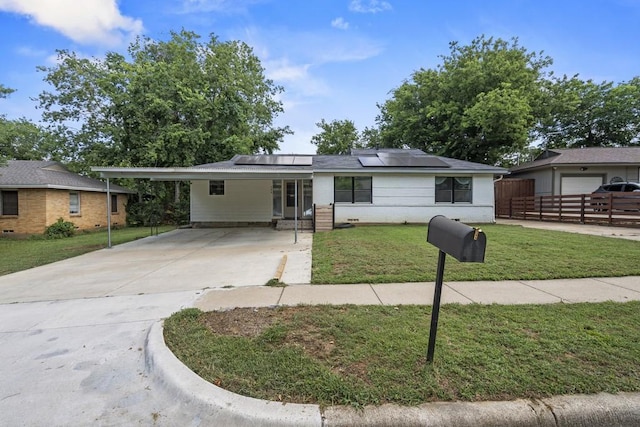 309 Overhill Dr, Arlington, TX 76010 - single story home featuring solar panels, concrete driveway, and a carport