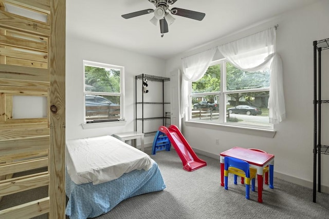 309 Overhill Dr, Arlington, TX 76010 - carpeted bedroom featuring baseboards and ceiling fan