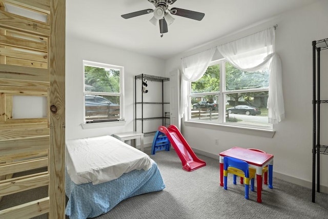 bedroom featuring carpet flooring, a ceiling fan, and baseboards