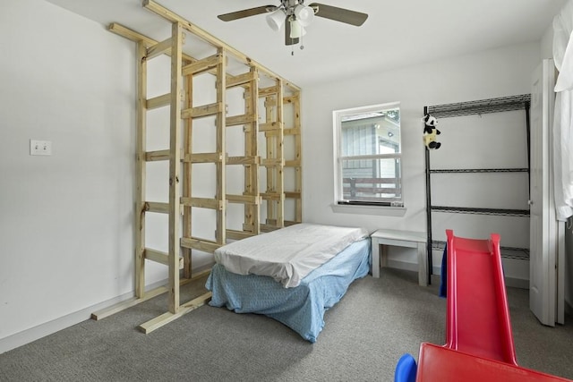 bedroom with ceiling fan, carpet, and baseboards