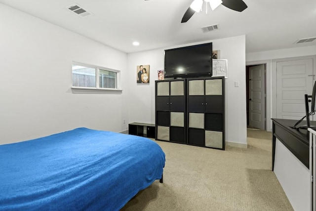 bedroom with carpet floors, visible vents, and baseboards