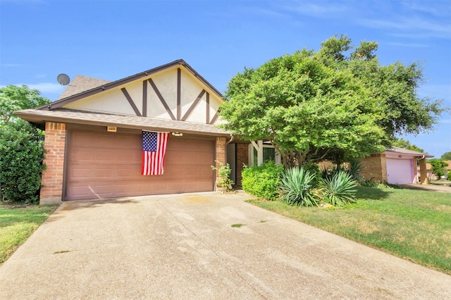 tudor-style house with a front yard