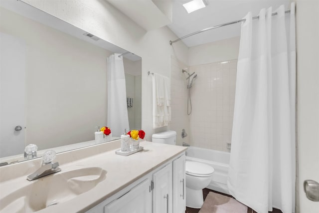 full bathroom featuring vanity, shower / bath combination with curtain, and toilet