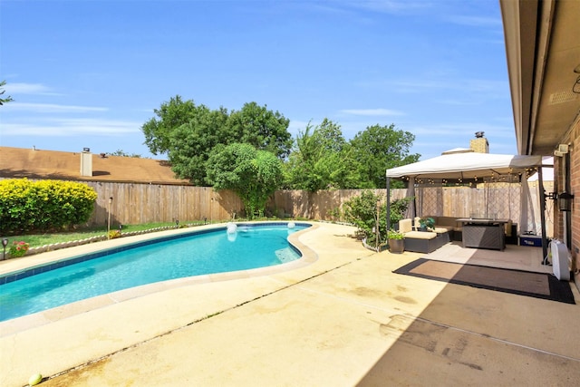 view of pool with a gazebo, outdoor lounge area, and a patio