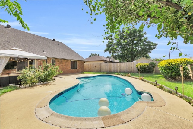 view of swimming pool with a gazebo and a patio area
