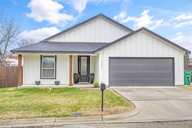 300 W College St, Jacksboro, TX 76458 - view of front of property with a garage, a porch, and a front yard