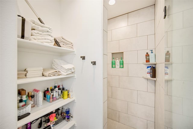 bathroom with tiled shower