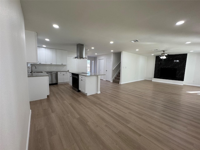 12009 Saddlehorn Ln, Mansfield, TX 76063 - kitchen featuring stove, range hood, dishwasher, light wood-style flooring, and recessed lighting