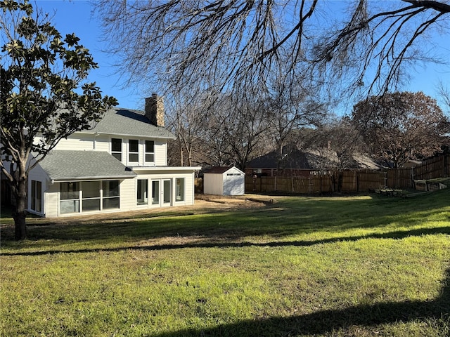 12009 Saddlehorn Ln, Mansfield, TX 76063 - view of yard featuring a sunroom and a storage unit