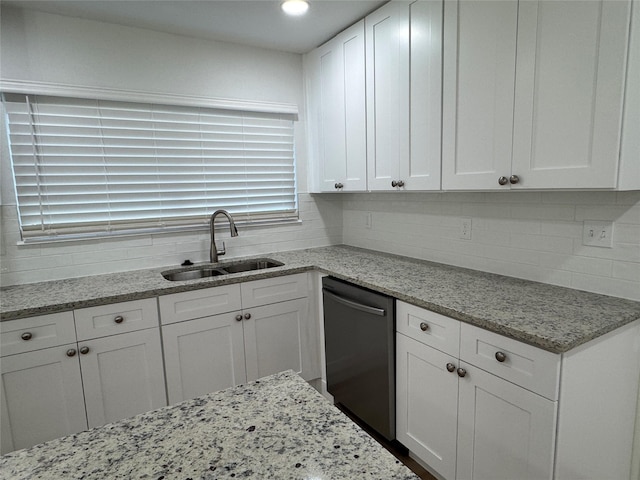 12009 Saddlehorn Ln, Mansfield, TX 76063 - kitchen featuring dishwasher, white cabinetry, backsplash, light stone countertops, and recessed lighting