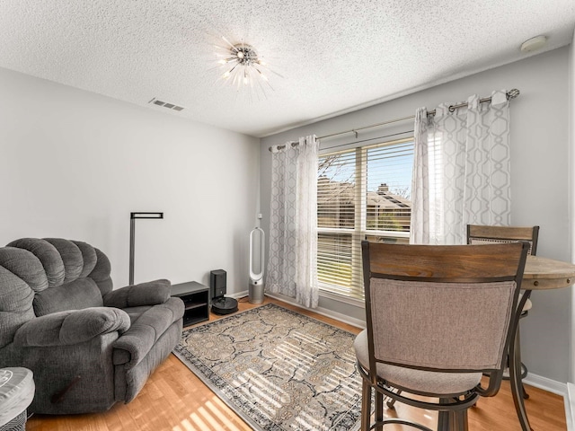 office with a textured ceiling and hardwood / wood-style flooring