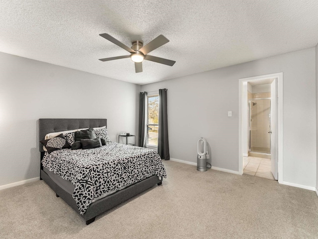 bedroom featuring a textured ceiling, light carpet, and ceiling fan