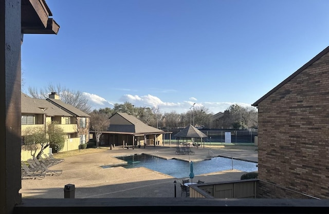 view of swimming pool featuring a gazebo and a patio area