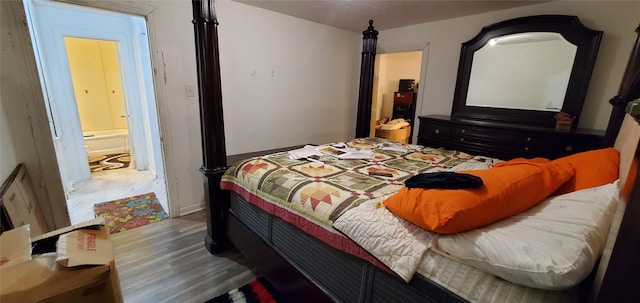 bedroom with hardwood / wood-style floors