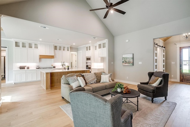 2000 Cumberland Cir, Corsicana, TX 75110 - living area with light wood finished floors, visible vents, recessed lighting, ceiling fan, and high vaulted ceiling