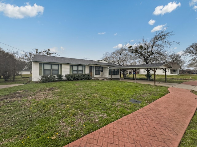 ranch-style house with a carport and a front yard