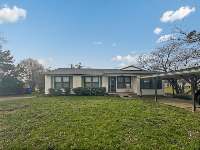 ranch-style house with a carport and a front yard