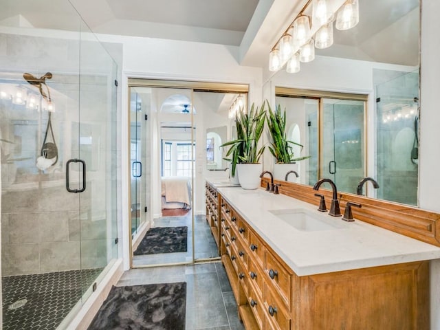 bathroom with vanity, an enclosed shower, and vaulted ceiling