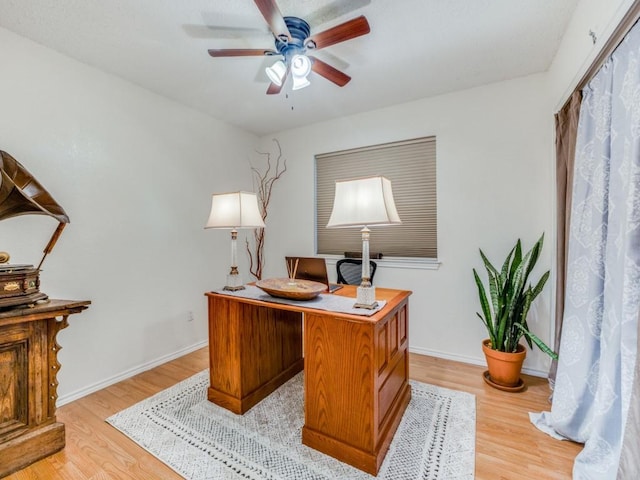 home office with ceiling fan and light wood-type flooring