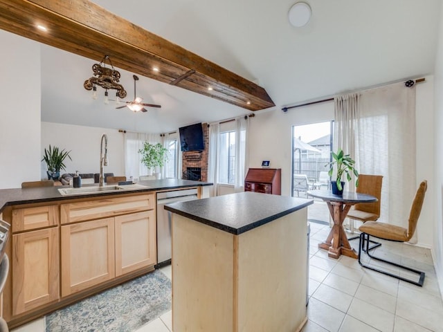 kitchen with sink, a center island, lofted ceiling with beams, light brown cabinets, and stainless steel dishwasher