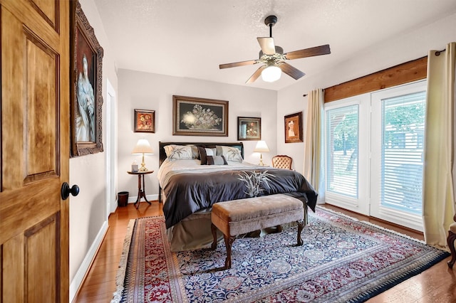 206 Pueblo Dr E, Lake Kiowa, TX 76240 - bedroom with baseboards, access to exterior, ceiling fan, and light wood-type flooring