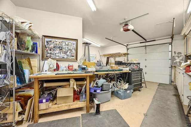 206 Pueblo Dr E, Lake Kiowa, TX 76240 - garage with a workshop area and a garage door opener