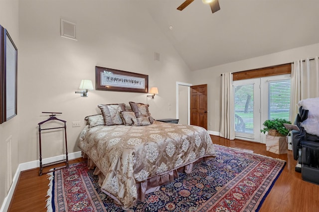 206 Pueblo Dr E, Lake Kiowa, TX 76240 - bedroom with baseboards, high vaulted ceiling, access to exterior, and wood finished floors
