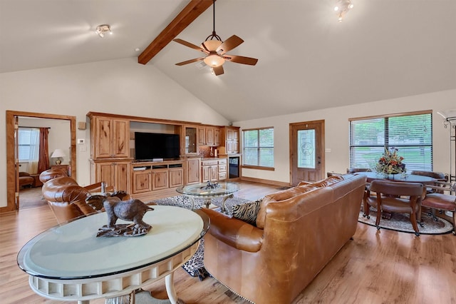 206 Pueblo Dr E, Lake Kiowa, TX 76240 - living room with light wood finished floors, ceiling fan, high vaulted ceiling, and beamed ceiling