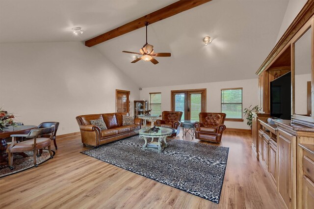 206 Pueblo Dr E, Lake Kiowa, TX 76240 - living area with baseboards, beamed ceiling, ceiling fan, and light wood-style flooring