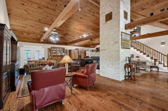 206 Pueblo Dr E, Lake Kiowa, TX 76240 - living room featuring wood-type flooring, a ceiling fan, wood ceiling, and beam ceiling