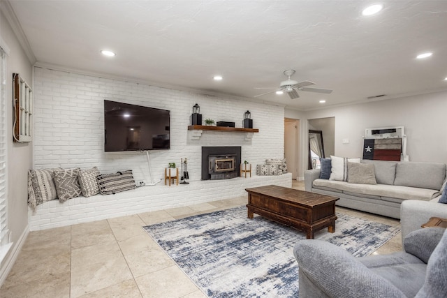 tiled living room with crown molding, brick wall, and ceiling fan