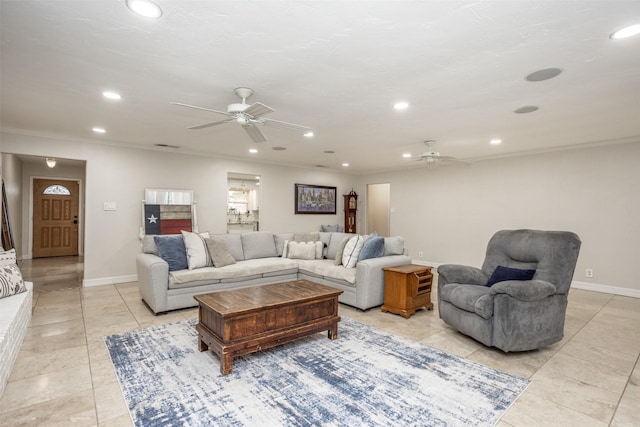 living room with ceiling fan, ornamental molding, and light tile patterned floors