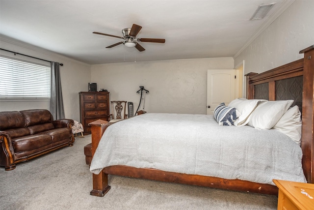 carpeted bedroom with ornamental molding and ceiling fan