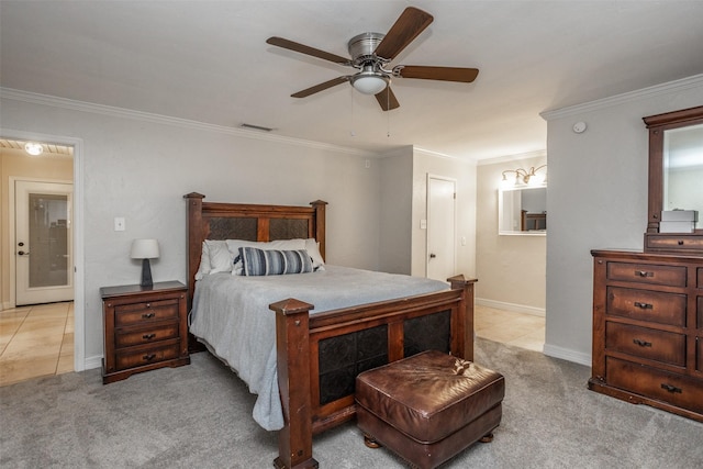 carpeted bedroom with ceiling fan, ornamental molding, and connected bathroom