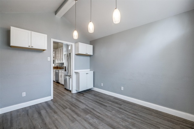 kitchen with lofted ceiling with beams, hanging light fixtures, dark hardwood / wood-style floors, stainless steel appliances, and white cabinets