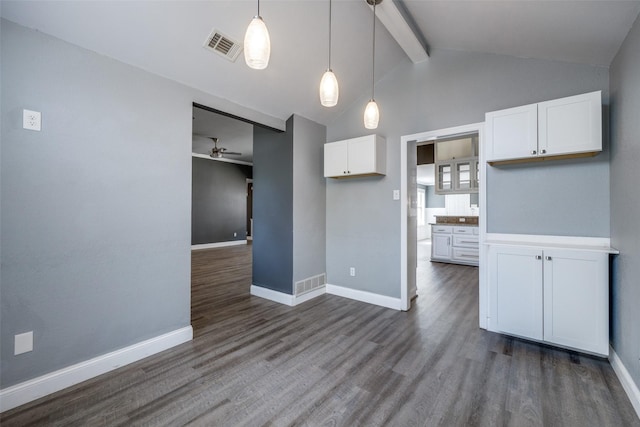 kitchen with white cabinetry, hanging light fixtures, ceiling fan, dark wood-type flooring, and beam ceiling