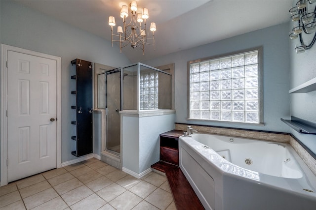 bathroom featuring an inviting chandelier, tile patterned floors, and plus walk in shower