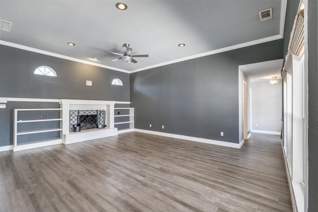 unfurnished living room with crown molding, ceiling fan, and wood-type flooring