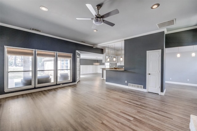 unfurnished living room with hardwood / wood-style floors and ceiling fan