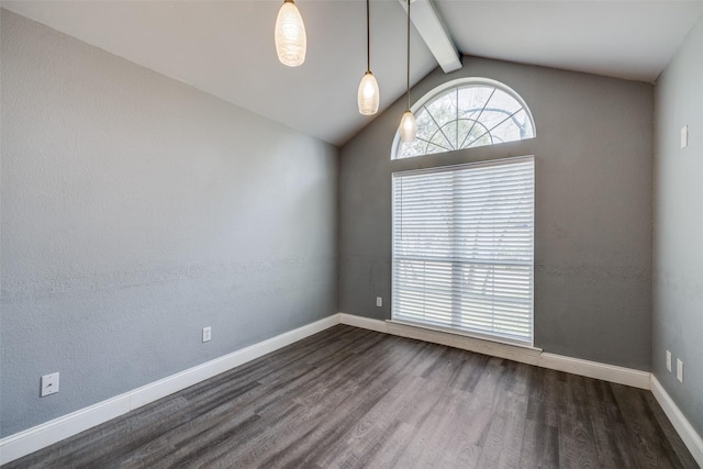 empty room featuring dark wood-type flooring and vaulted ceiling with beams