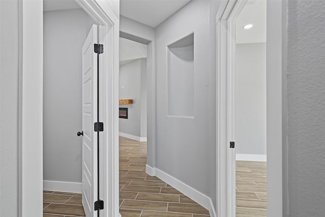 11298 Cedar Dr, Mabank, TX 75156 - hallway featuring wood tiled floors, baseboards, and recessed lighting
