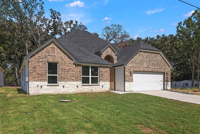 11298 Cedar Dr, Mabank, TX 75156 - french country inspired facade featuring brick siding, driveway, a garage, and a front lawn