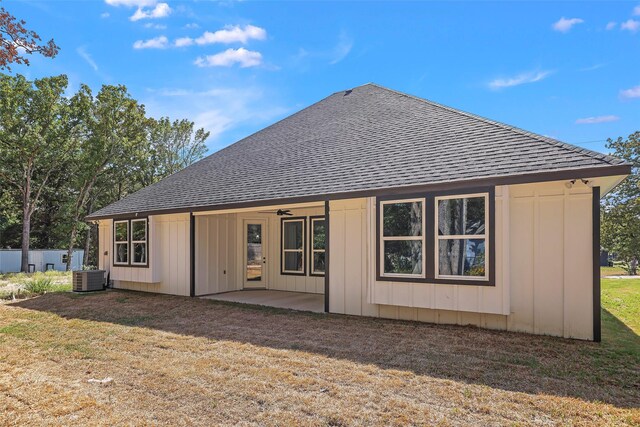 11298 Cedar Dr, Mabank, TX 75156 - rear view of house featuring roof with shingles, cooling unit, a patio, and a lawn