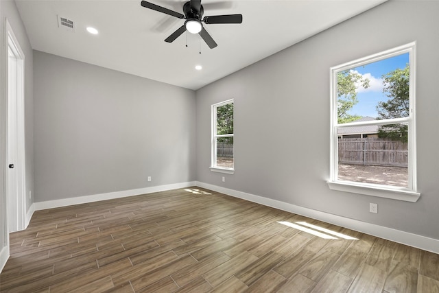 spare room featuring ceiling fan and wood-type flooring